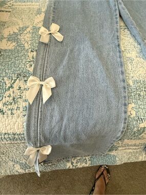 Light Wash Straight Leg Jeans with White Bow Accents